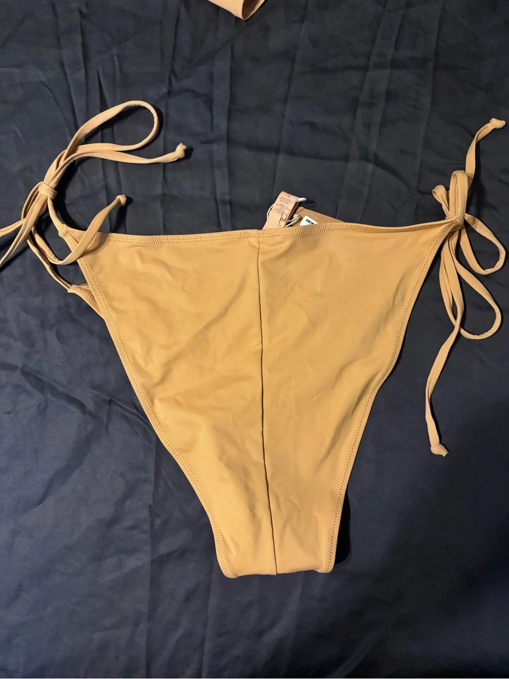 SKIMS SWIM RUCHED T-SHIRT and LOW RISE TIE BIKINI BOTTOM in Ochre